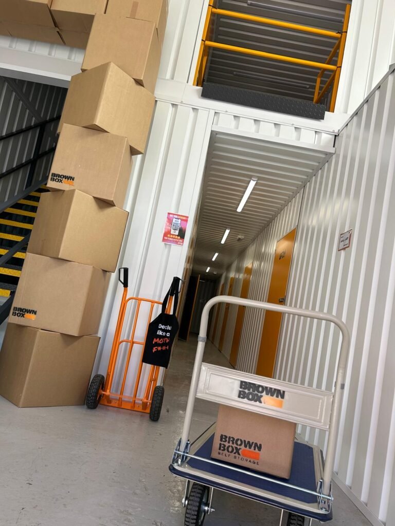 brown box trolley sack truck and brown box corridor